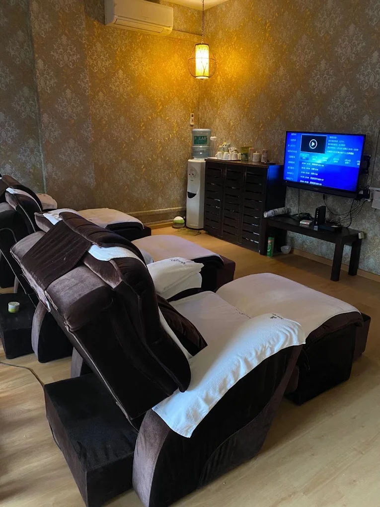 Foot reflexology lounge with reclining massage chairs