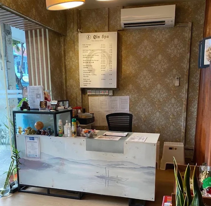 Reception counter and service menu at Qin Spa